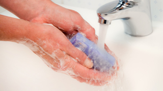 washing hands with a soap