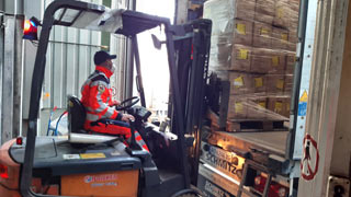 Forklift loads relief goods