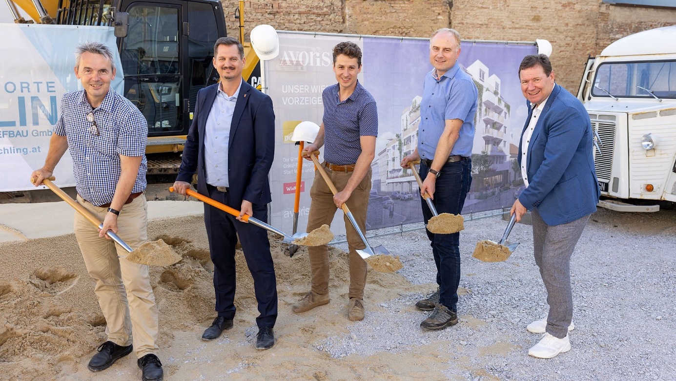 Groundbreaking for the "G'mischter Block" project

Groundbreaking ceremony showing five men holding spades and digging in the sand