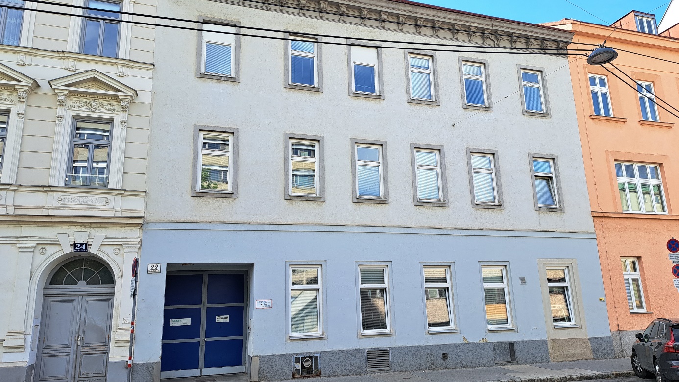 Sedlak Immobilien, Van-der-Nüll-Gasse 22

Light-blue, unadorned façade of a Gründerzeit building with ground-floor zone and two storeys; there are six windows per storey (except for the ground-floor level, which has only five); remnants of Gründerzeit ornamentation along the cornice; on the left: part of a Gründerzeit building with an arched door and its original / restored façade.