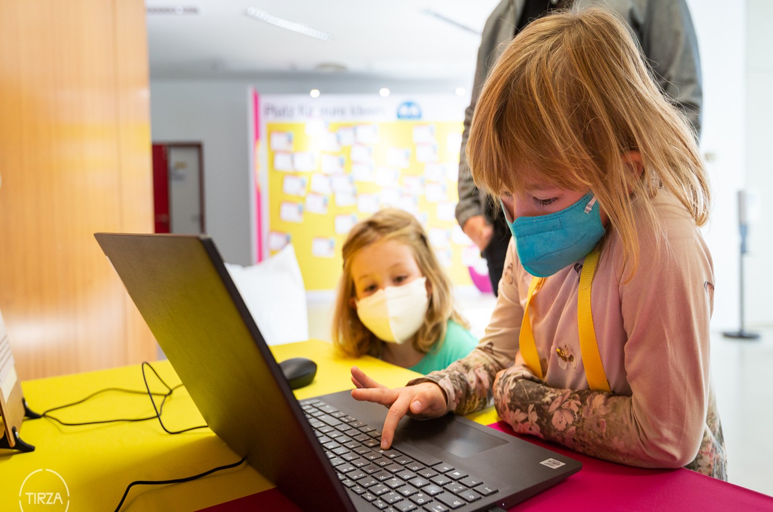 Research Festival

Elementary school-age girl in front of an open laptop, with another, younger girl in the background 