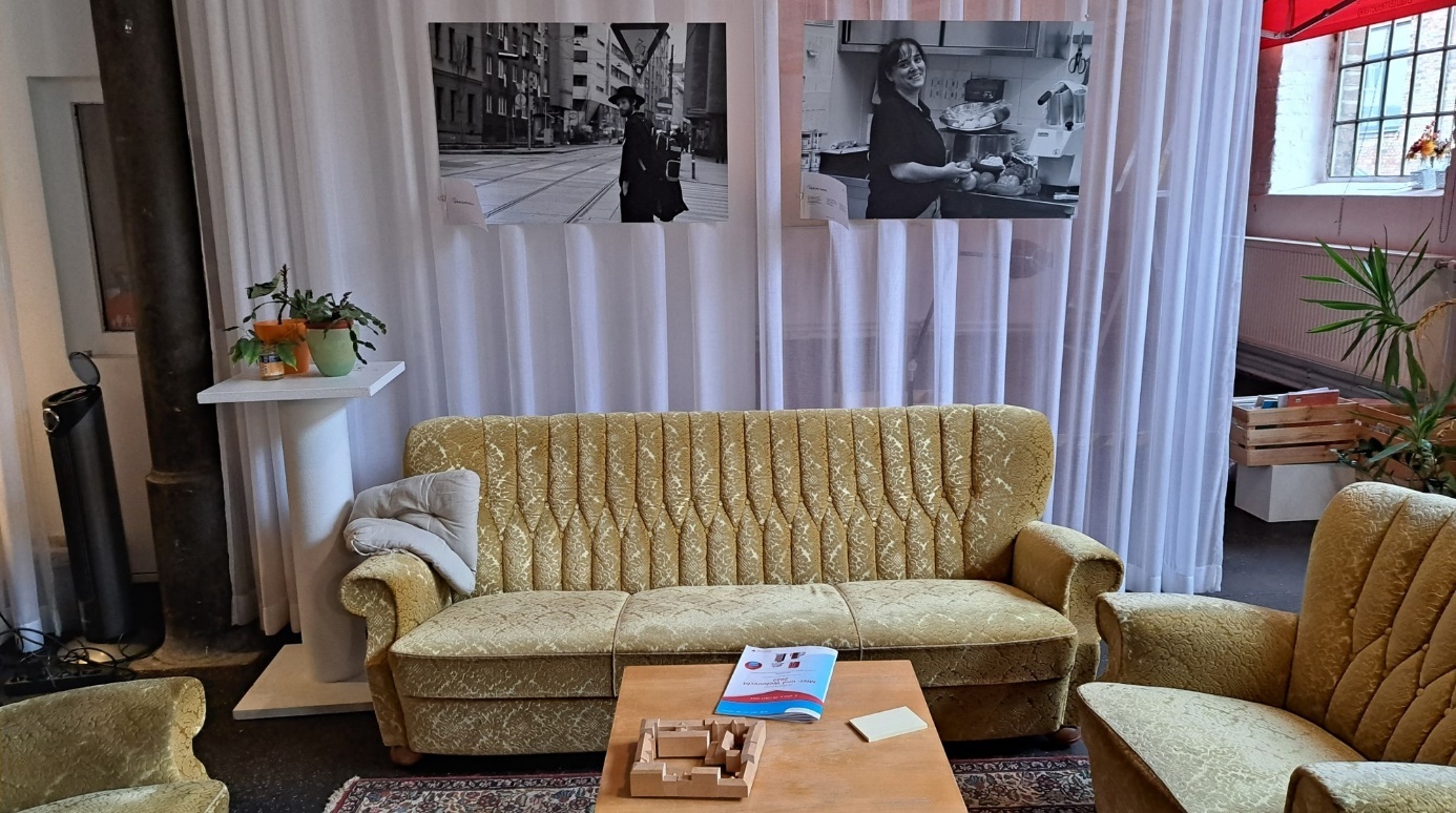 "Street Photography" project

Golden-yellow vintage sofa and two easy chairs with a coffee table in front of two large-format black-and-white photos 