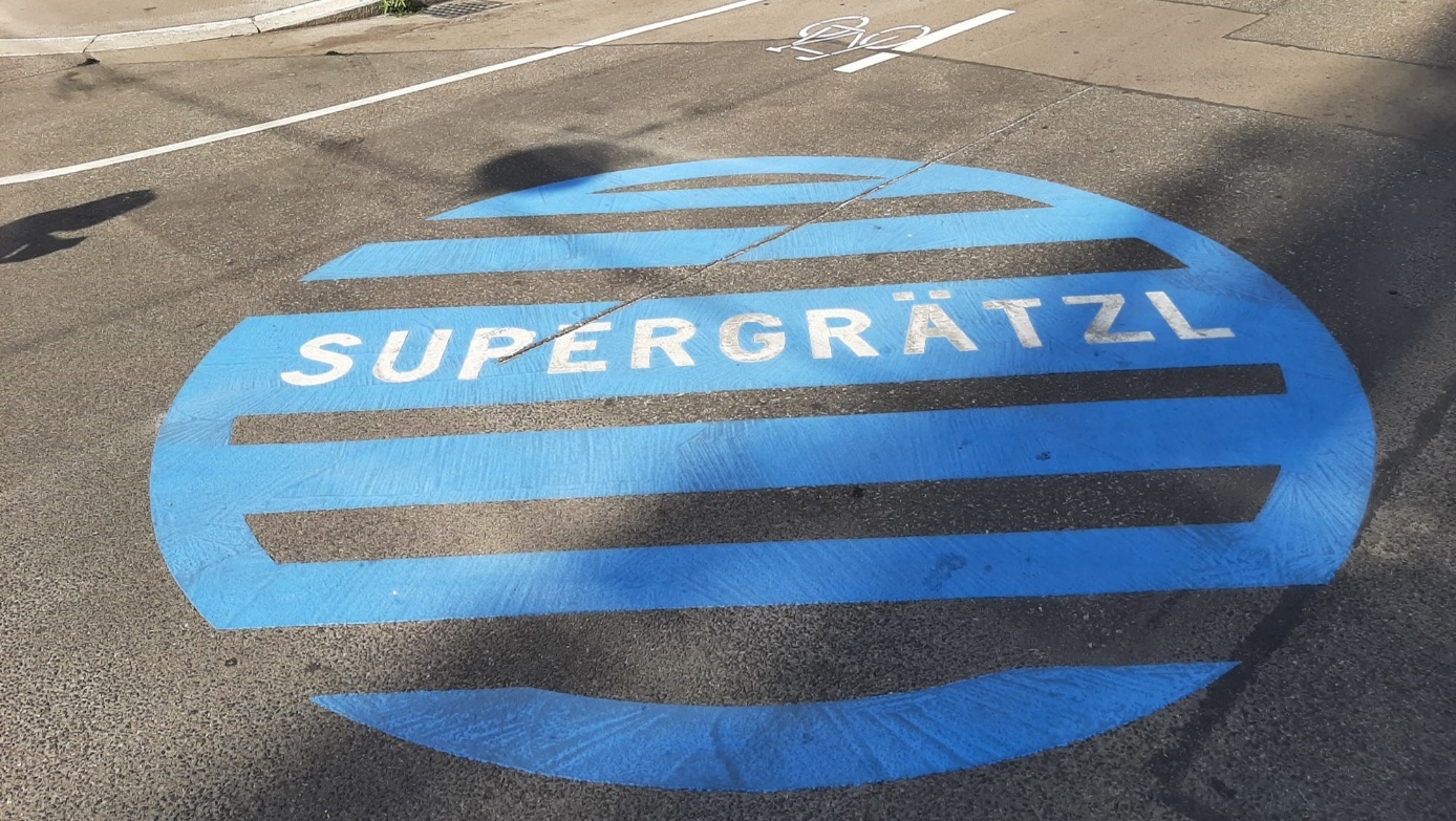 "Supergrätzl" road marking in blue

Light-blue, round "Supergrätzl" road marking on asphalted road surface