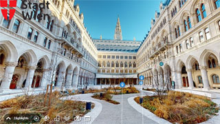 Screenshot des Arkadenhofs im Wiener Rathaus mit bunten Symbolen in der Mitte und einer Navigationsleiste unten